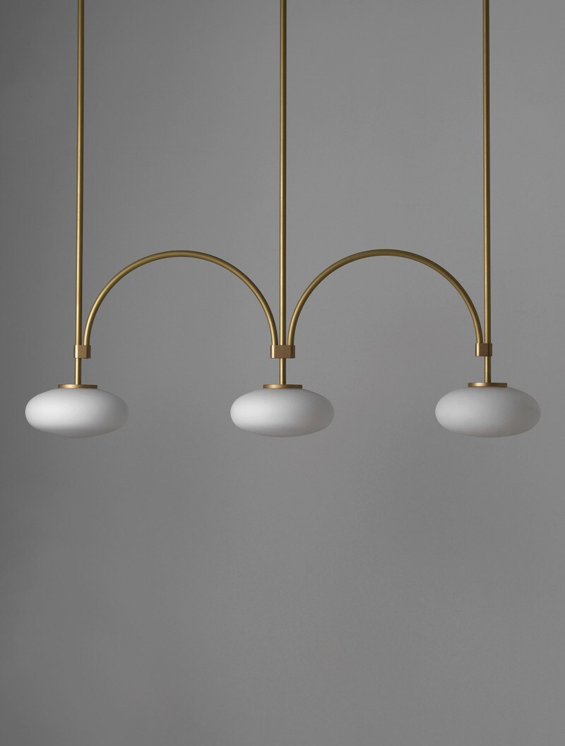 Ellipsis 3 shown in Stonewashed Brass and Matte White Glass